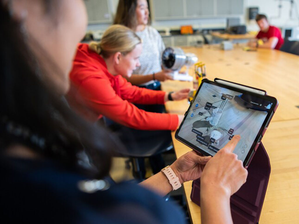 Dr. Aneesha Gogineni shows a student the Solidworks model image on her tablet used for student research.